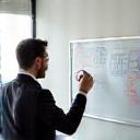 Person planning on a whiteboard