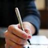 Journalist writing notes during an interview